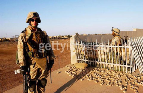 Lieutenant Jason Radion, from Pittsburgh, Pennsylvania, stands beside a position as US Marines of 2nd Battalion 1st Marine Regiment maintain their cordon at the key flashpoint Fallujah railway station on May 6, 2004 in Iraq.